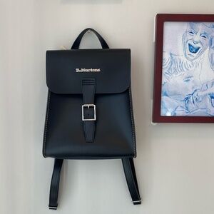 Never-used, black leather Dr. Martens backpack. 10.5 inches long, 3.5inches in w
